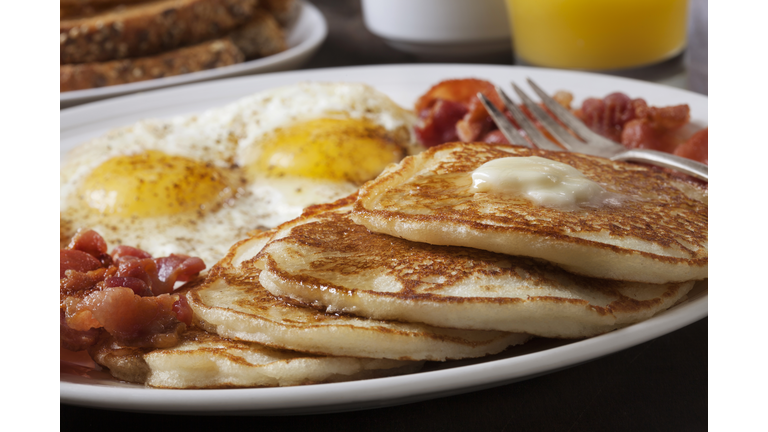 Grand Slam Breakfast with Pancakes, Bacon, Eggs, and Toast