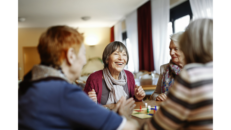 Senior Women Playing Board Game