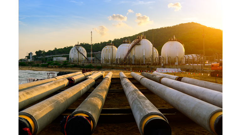 Distillation tank of oil refinery plant, morning time