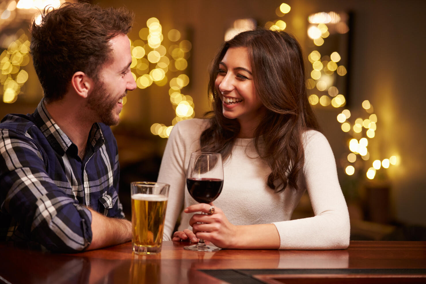 Couple Enjoying Evening Drinks In Bar