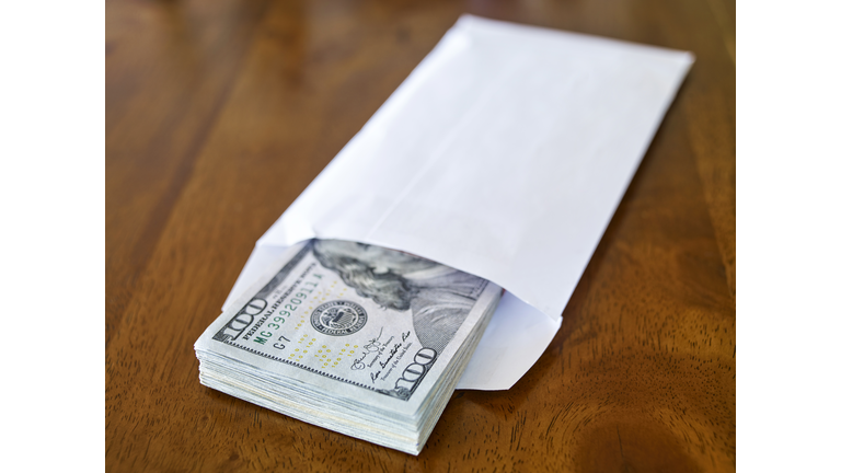 Dollar pile in an envelope