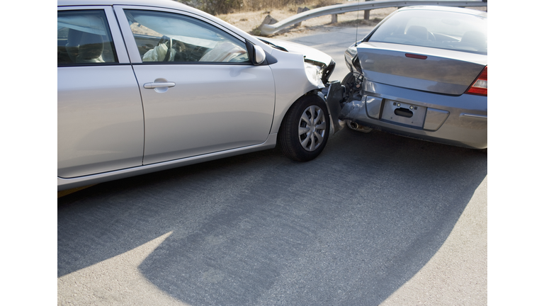 Two cars in collision on roadway