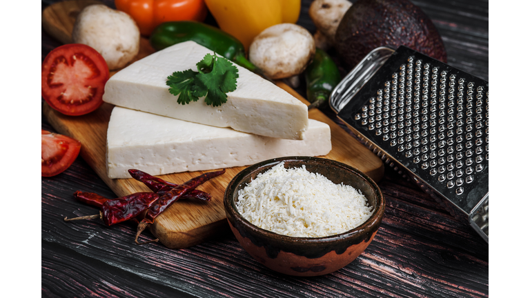 Mexican white Cotija cheese, tequila shot with fresh ingredients in Mexico Latin America