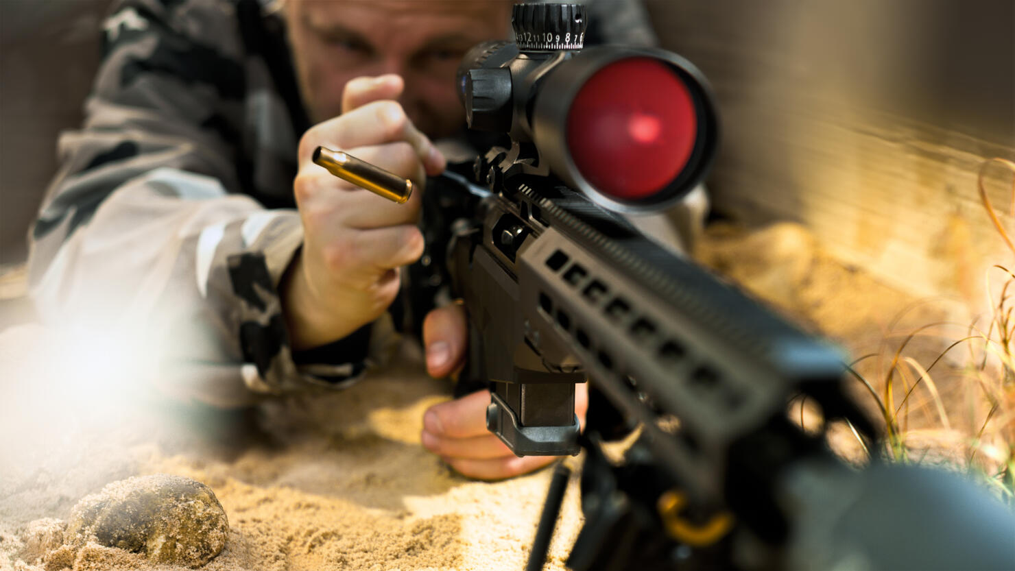 Soldier firing machine gun during battle