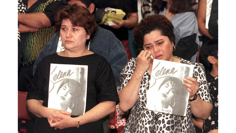 Estella Leak(R) wipes away tears during a memorial