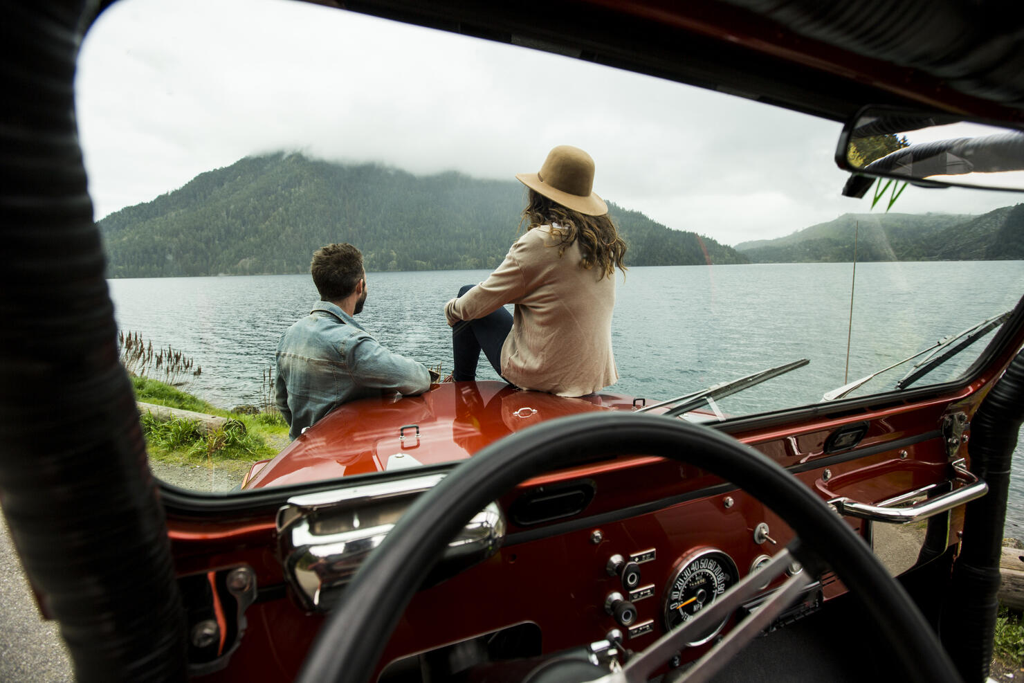 A couple in a convertible.