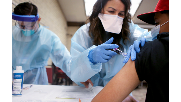 Southern California Residents Line Up For Flu Shots At Local Library