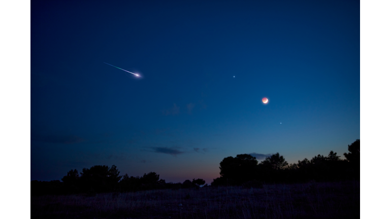 Landscape silhouette of a evening sky with crescent Moon eclipse, meteor, shooting star and planets.
