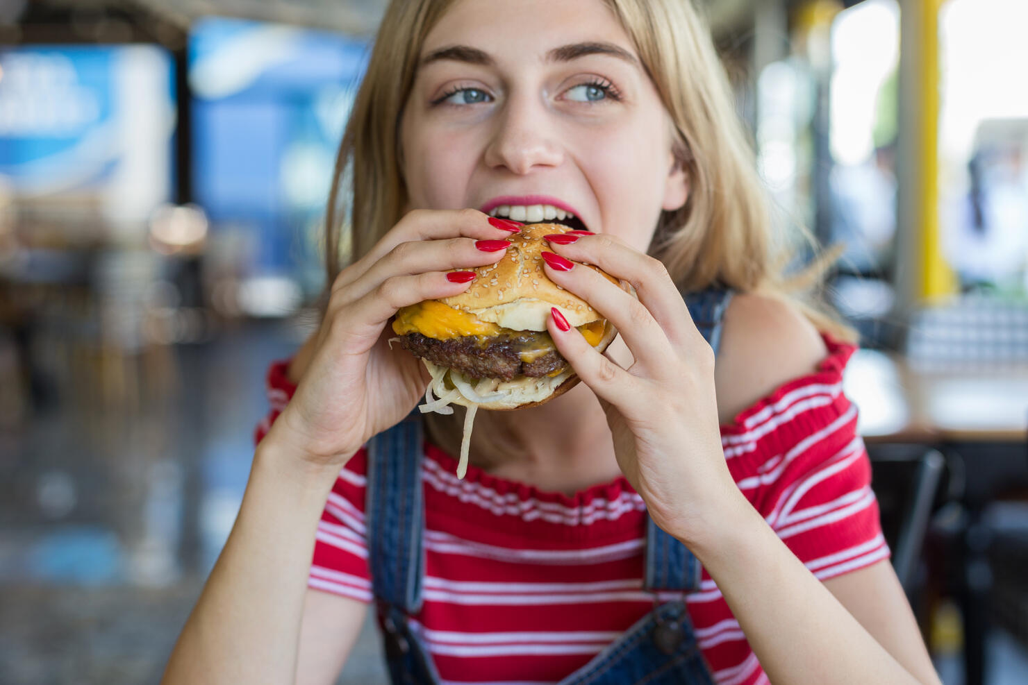 Woman eating burger