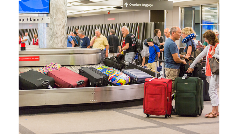 Travelers waiting for their luggage