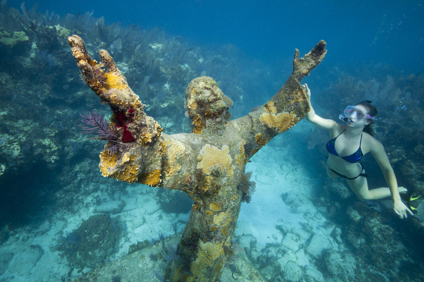 Snorkeler with Bronze Statue of Christ.