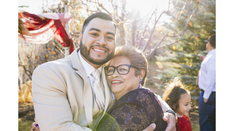 Groom celebrating wedding with relatives