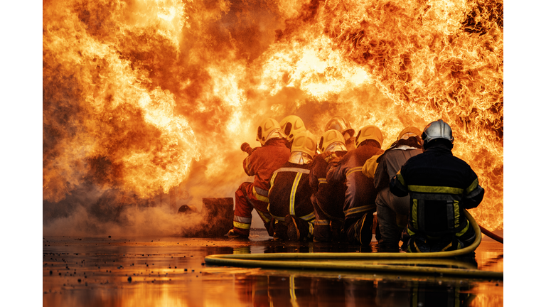 Firefighters extinguishing an industrial fire