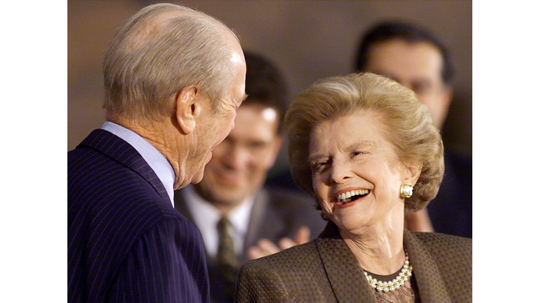 Former First Lady Betty Ford (R) looks at her husb