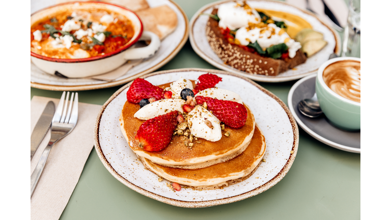 Pancakes with strawberries for breakfast at the cafe