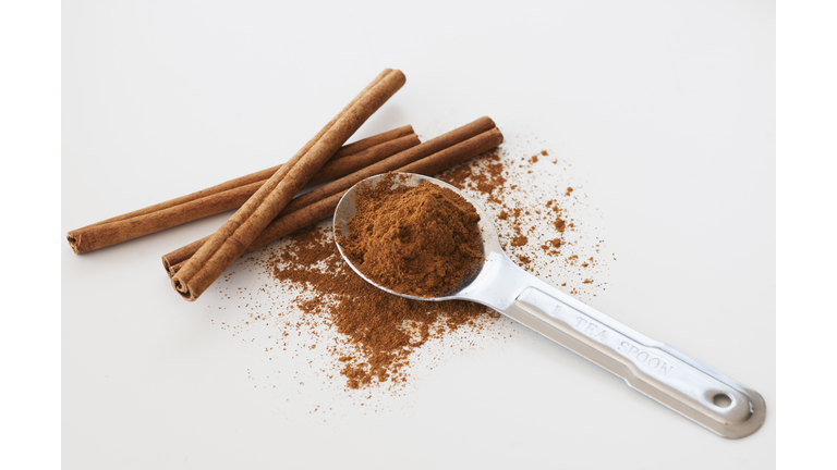 Studio shot of cinnamon stick and cinnamon powder