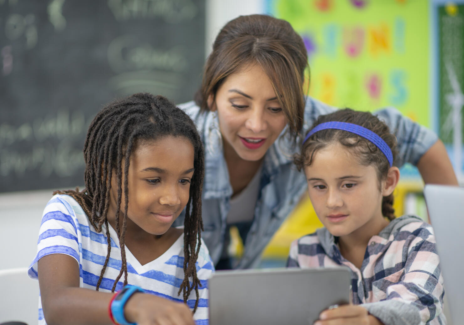 Teacher Assisting Students