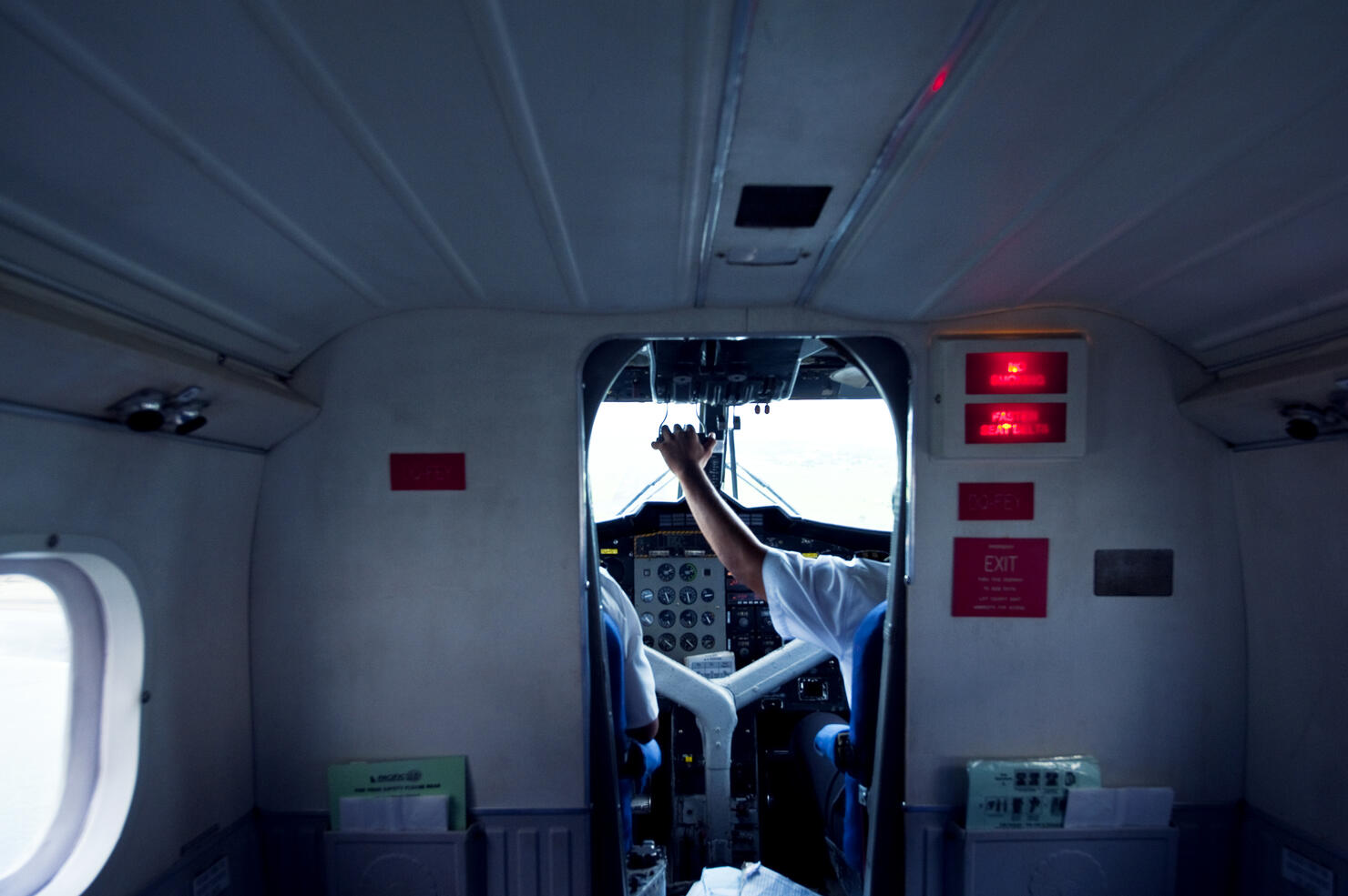 A pilot in the cockpit controls the planes acceleration in take-off.
