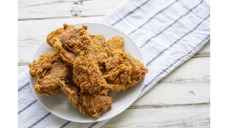 White Plate of Fried Chicken on Wood Table