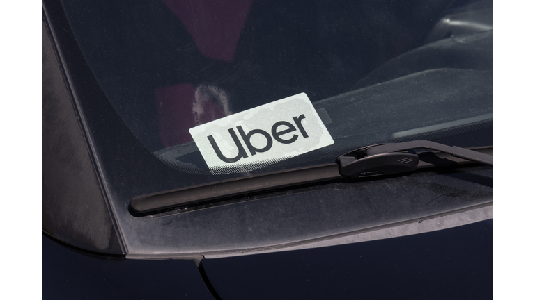 Uber Car for hire sticker. Lyft and Uber have replaced many Taxi cabs for transportation with a smart phone app.