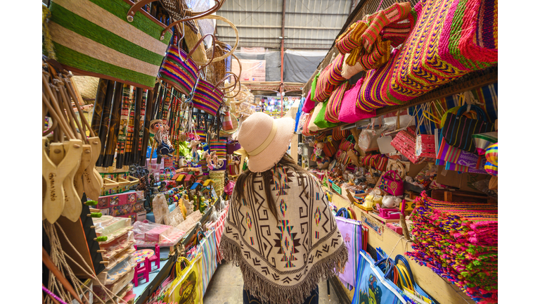 Tourist shopping for souvenirs at the Hidalgo market in Guanajuato, Mexico