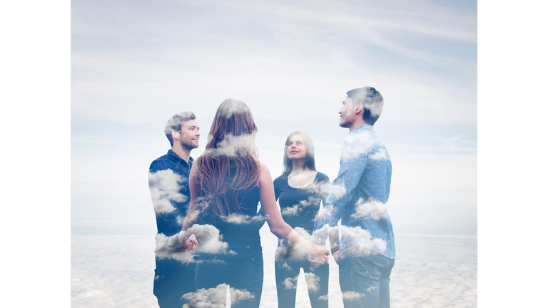 Four friends holding hands with clouds.