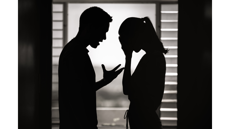 Argument. Man and woman having an argument at home.