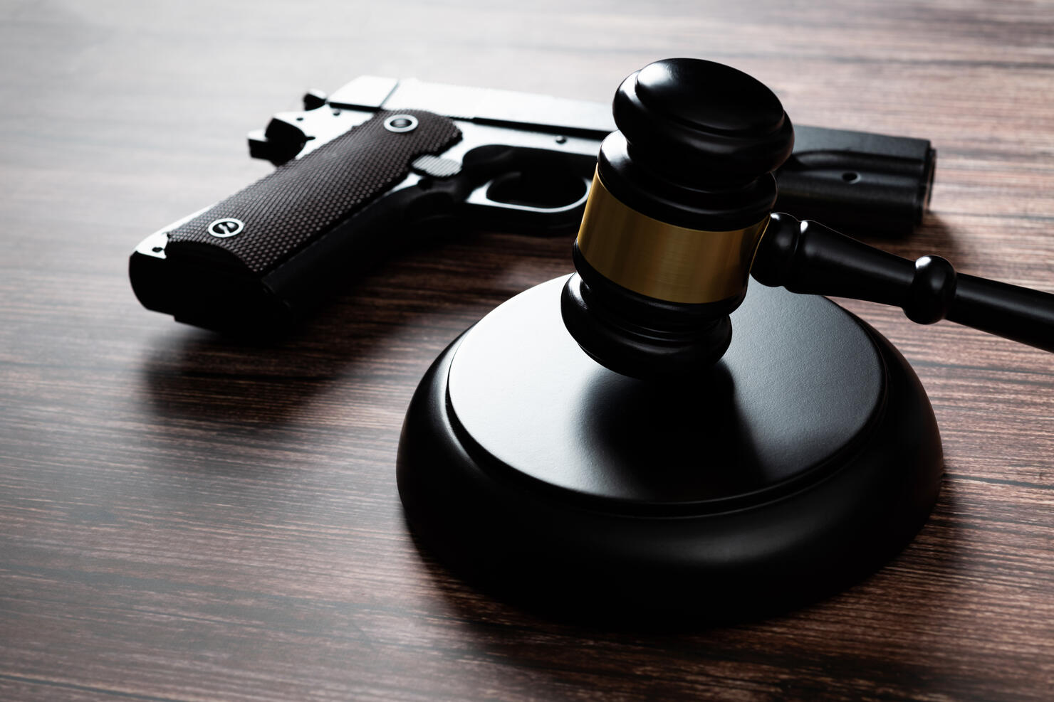 Gun and gavel on the table