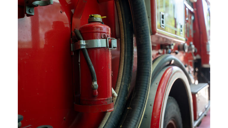 Firemen equipment on fire truck,Fire engine with equipment stay in the fire department.