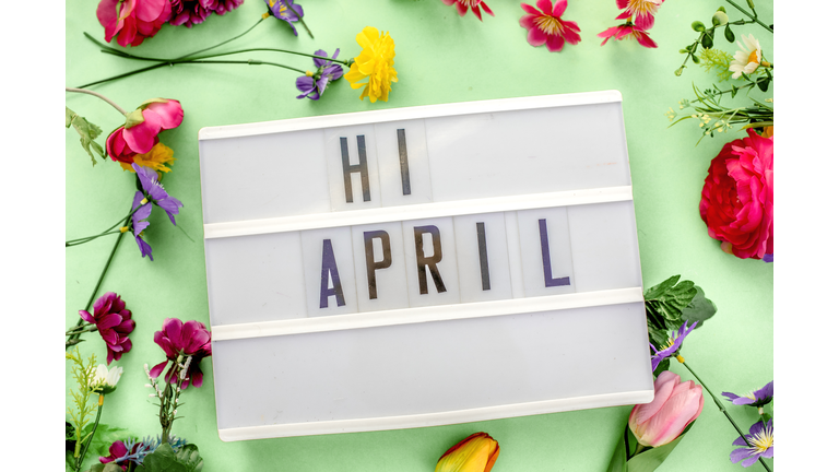 april message in lightbox. Floral and gren bacground