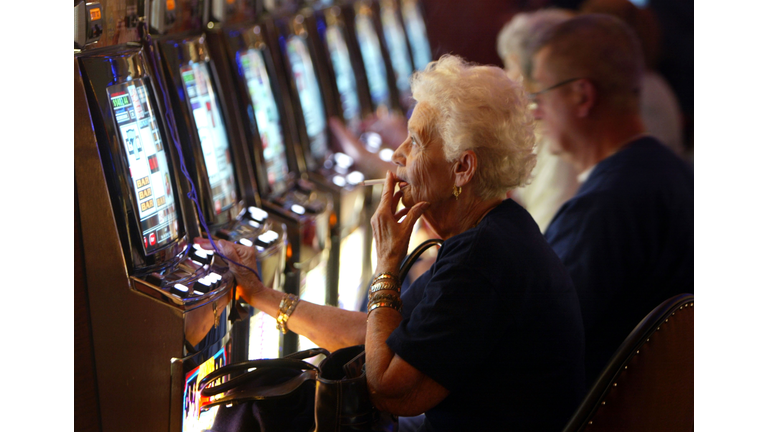 A casino patron smokes a cigarette