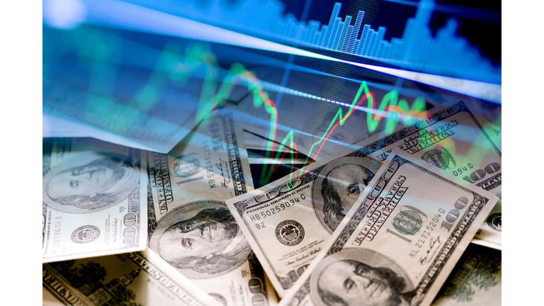 Cash dollar bills and stock market indicators