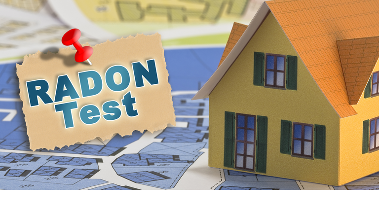 The danger of natural radon gas in our homes - Radon Testing concept with an home model