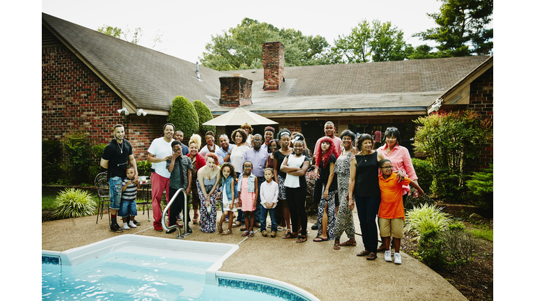 Portrait of multigenerational family in backyard