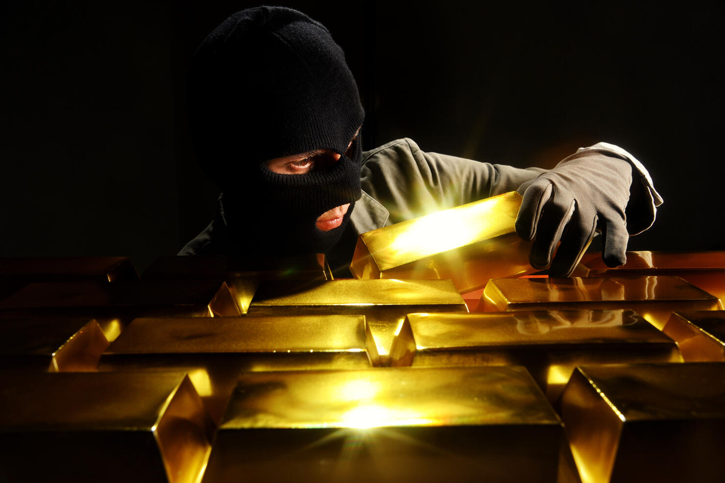 Thief stealing gold bars