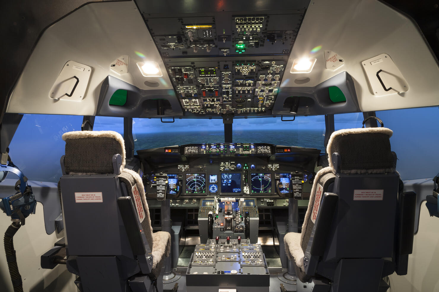 Seat and controller in cock pit of flight simulator