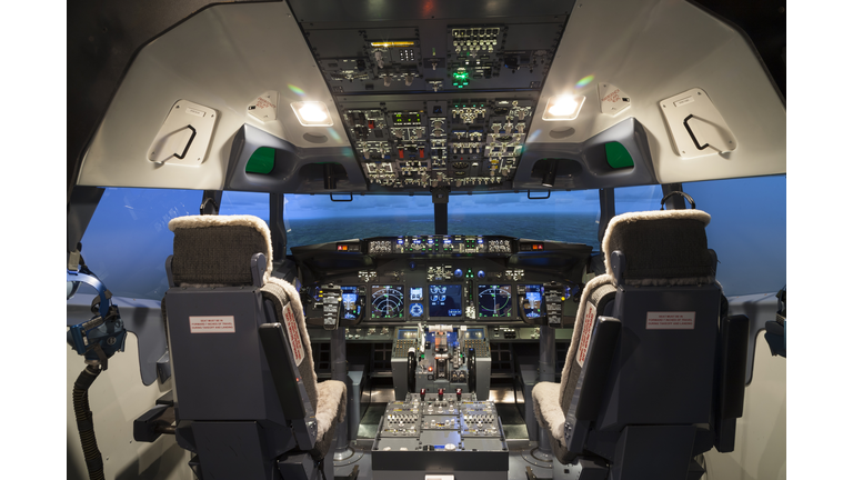 Seat and controller in cock pit of flight simulator