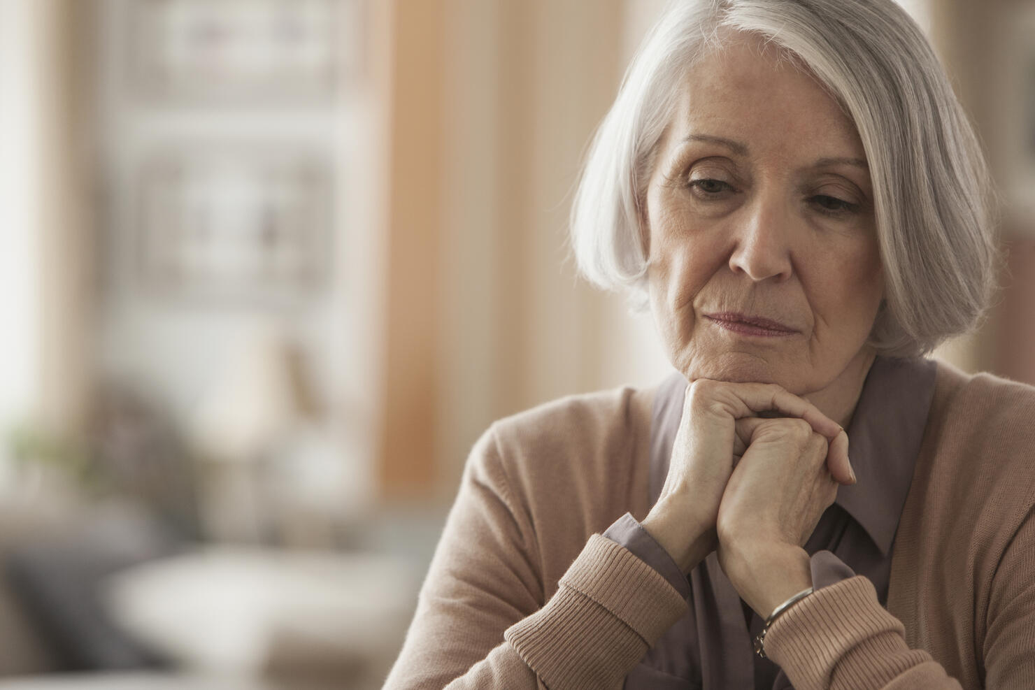 Senior Caucasian woman with chin in hands