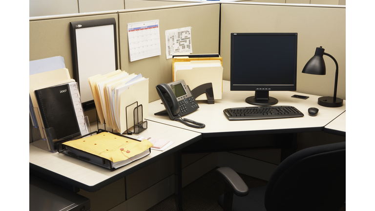 Computer and landline phone in office, elevated view