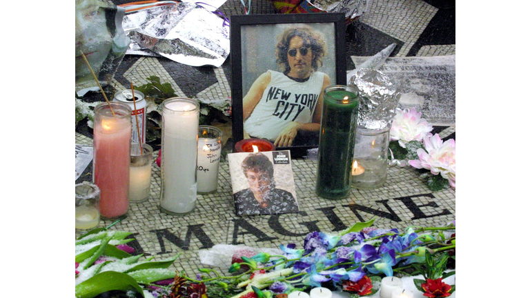 Flowers and candles adorn a memorial to slain sing