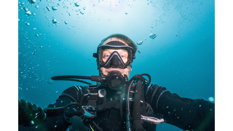 diver taking a selfie on a dive around Phuket