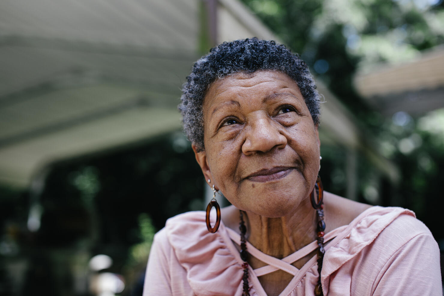 Close-up portrait of senior black woman looking thoughtful