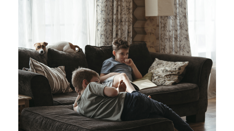 Children watch TV at home.