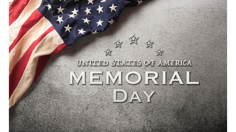 Happy memorial day concept made from American flag and the text on dark stone background.