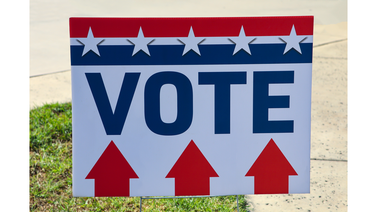 “Vote” directional sign