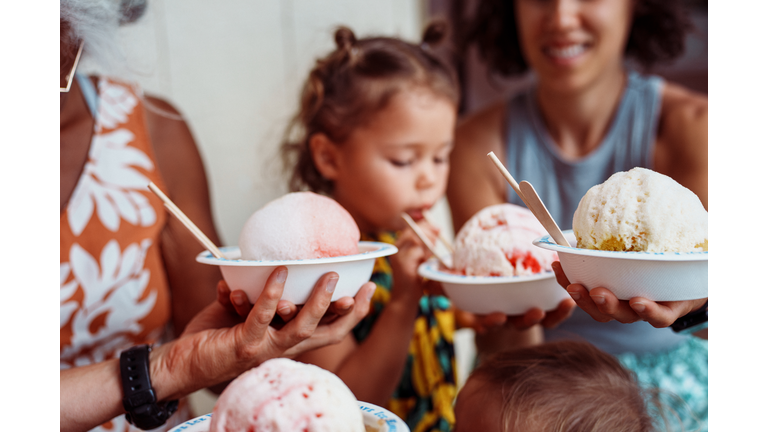 Multi-generation family enjoying Hawaiian shave ice