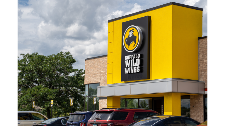 Exterior of a Buffalo Wild Wings chain restaurant. Also known as B-Dubs, this dine-in establishment sells chicken wings and pub food