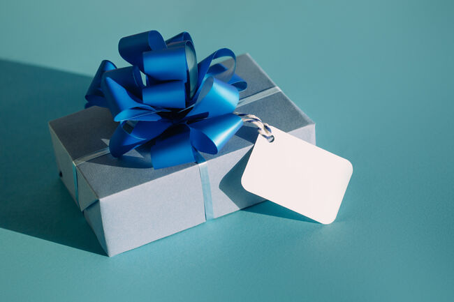 Elegant present with blank tag. Trendy colors of the year