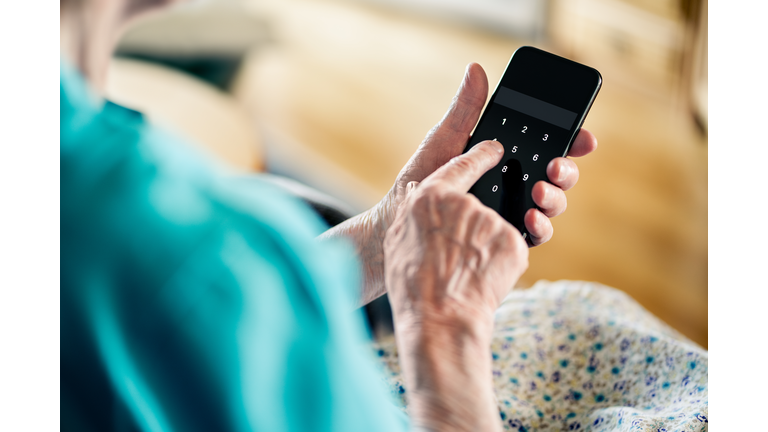 Old senior woman and phone password number code against online scam. Cyber security. Elder mature person protect bank data with pin lock. Fraud and hoax safety.