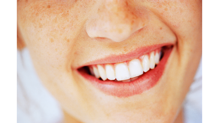 Young woman smiling, close-up